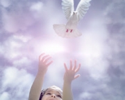 Girl Releasing a Dove --- Image by Â© Tom Grill/Corbis