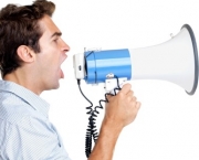 Profile image of a young man shouting into a megaphone