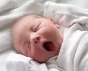 Yawning baby taking a nap